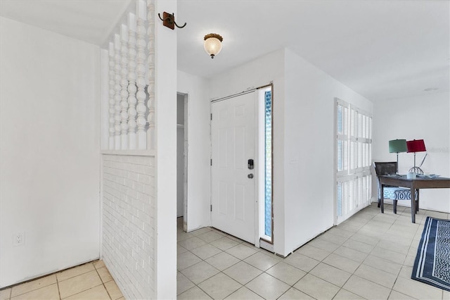 foyer entrance with light tile patterned floors