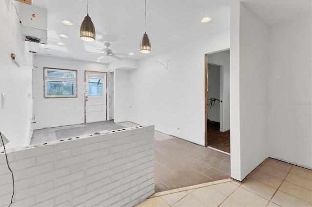 tiled empty room with ceiling fan