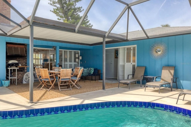 back of property featuring a patio and a lanai