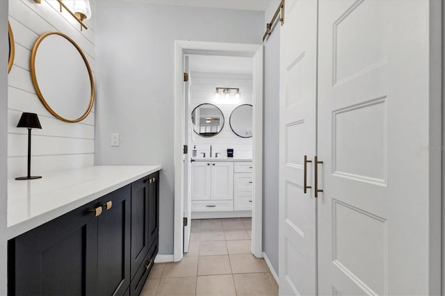 bathroom with tile patterned floors and vanity