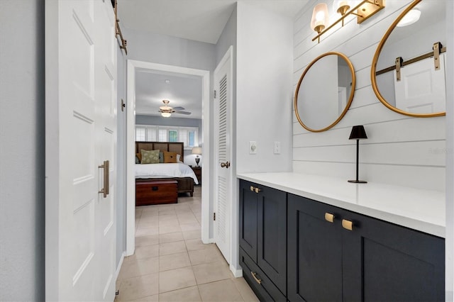 bathroom featuring vanity, tile patterned floors, and ceiling fan