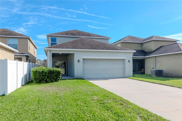 view of front facade with a front yard, a garage, and cooling unit