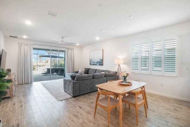 dining space with ceiling fan