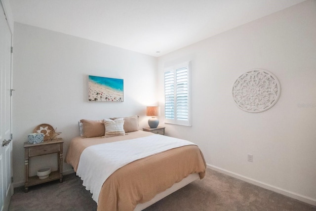 bedroom featuring dark colored carpet