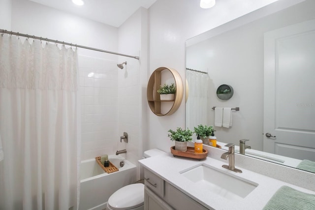 full bathroom with shower / bath combination with curtain, vanity, and toilet