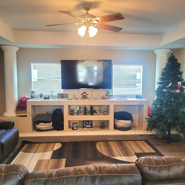 living room featuring hardwood / wood-style floors, ceiling fan, and a healthy amount of sunlight