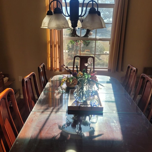 dining space with an inviting chandelier