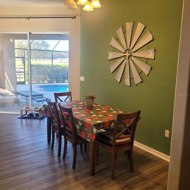 dining area with dark hardwood / wood-style flooring