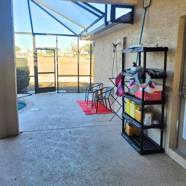 view of patio / terrace with glass enclosure