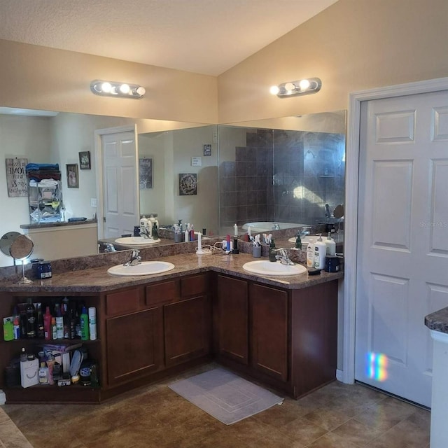 bathroom featuring vanity and vaulted ceiling