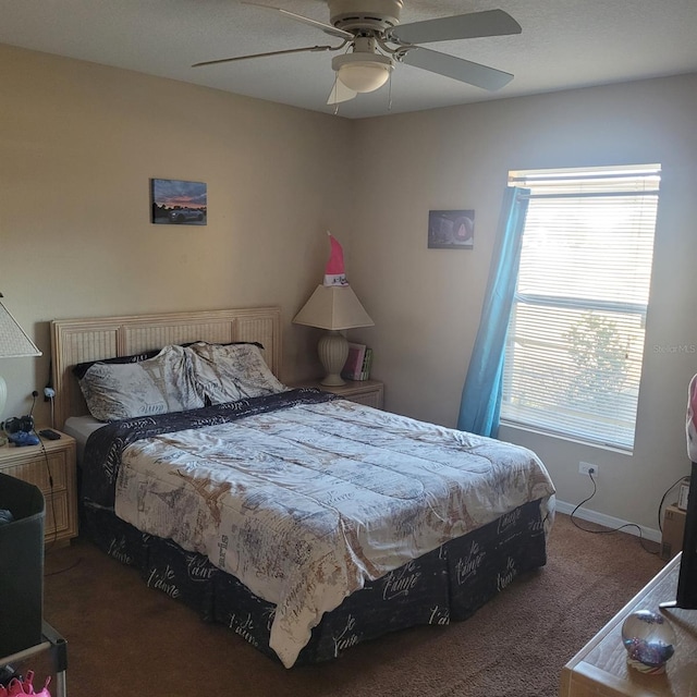 bedroom with ceiling fan and carpet floors