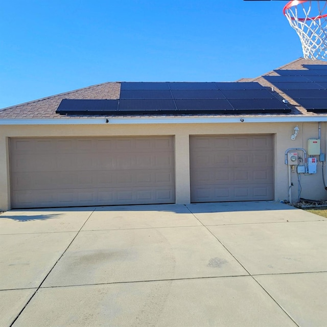 garage featuring solar panels