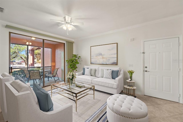 living room featuring light tile patterned floors, ceiling fan, and crown molding