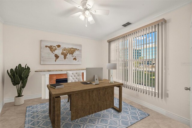 tiled home office with plenty of natural light, ceiling fan, and crown molding