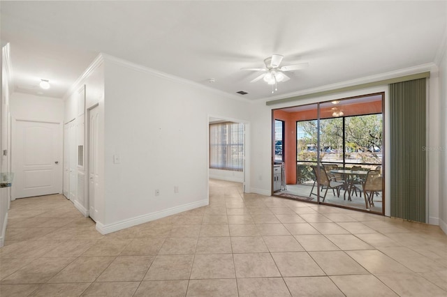 unfurnished room featuring ceiling fan, crown molding, and light tile patterned flooring