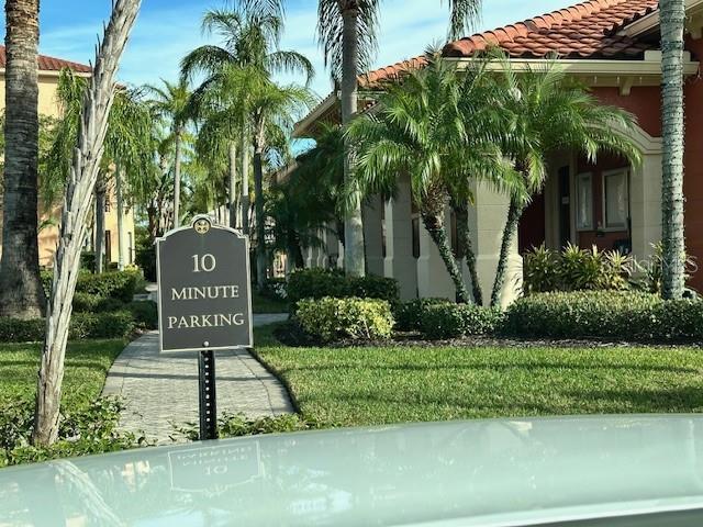 community sign featuring a yard