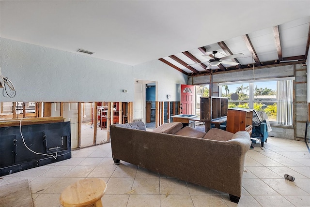 tiled living room featuring lofted ceiling with beams, a wealth of natural light, and ceiling fan