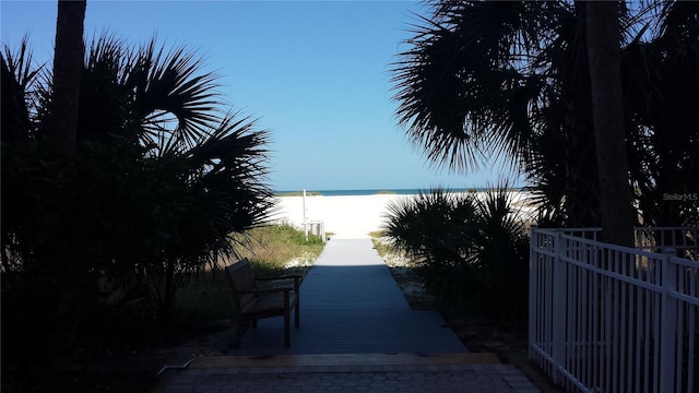 view of road with a water view and a view of the beach