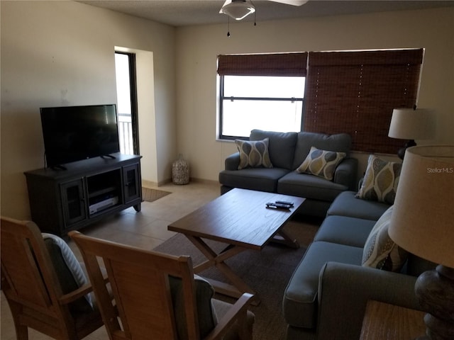 living room with ceiling fan and a wealth of natural light