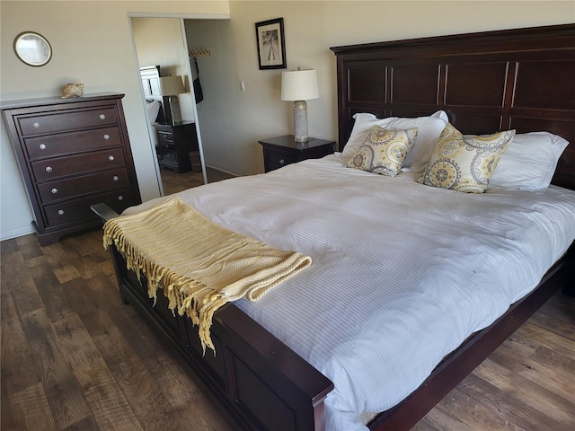 bedroom with dark wood-type flooring