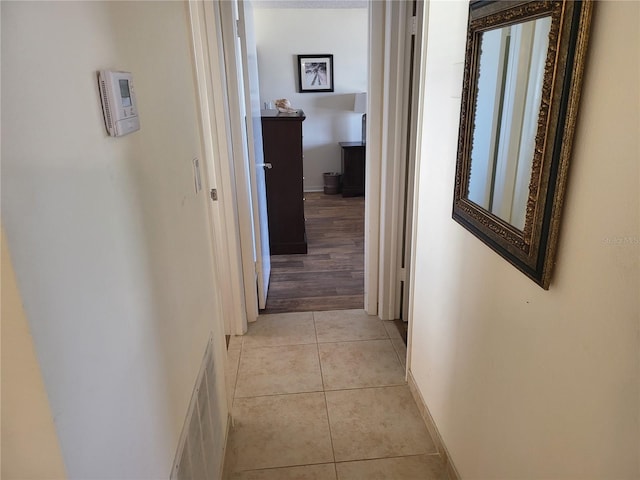 hall with light tile patterned flooring