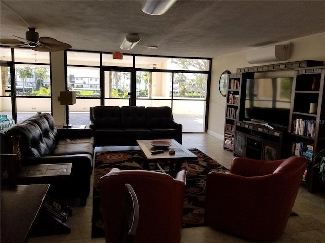 living room featuring ceiling fan, a wealth of natural light, and a wall mounted AC