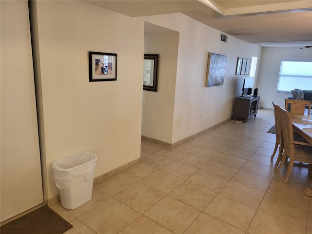 hall with light tile patterned flooring