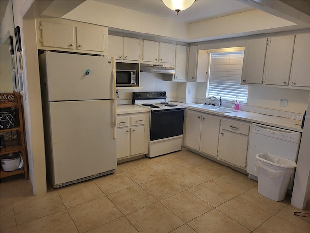 kitchen featuring sink, light tile patterned floors, and white appliances