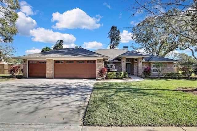 view of front of home featuring a garage and a front lawn