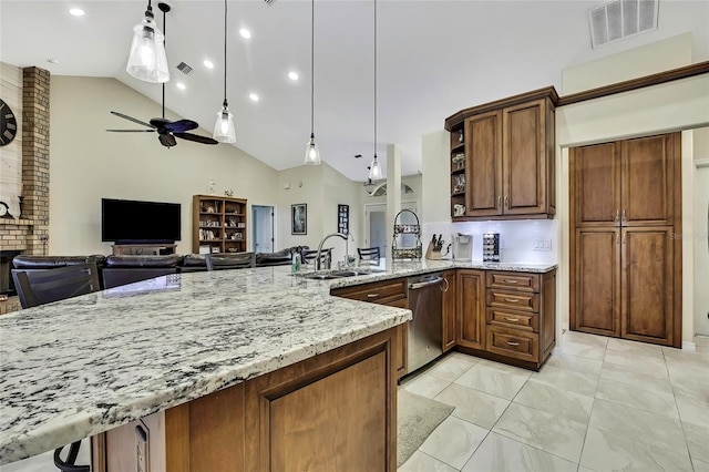 kitchen with dishwasher, pendant lighting, ceiling fan, and sink