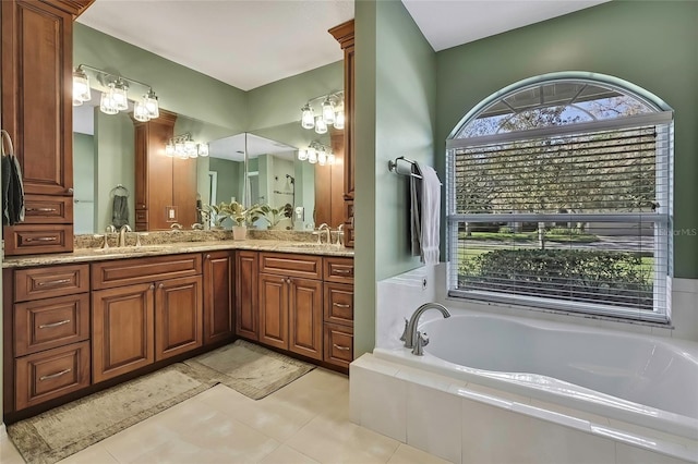 bathroom featuring tile patterned floors, vanity, and a healthy amount of sunlight