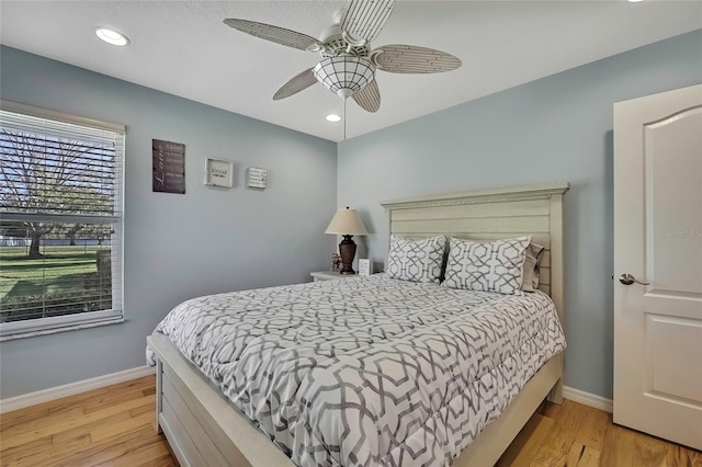 bedroom featuring ceiling fan and light wood-type flooring