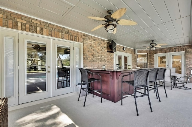 view of patio with french doors and an outdoor bar