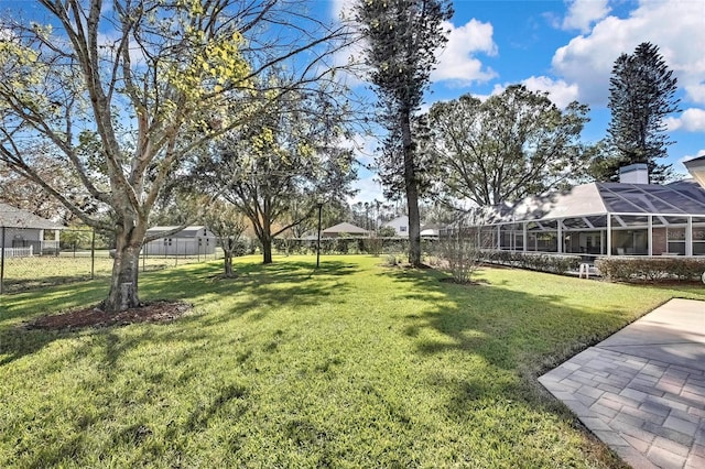 view of yard with a lanai