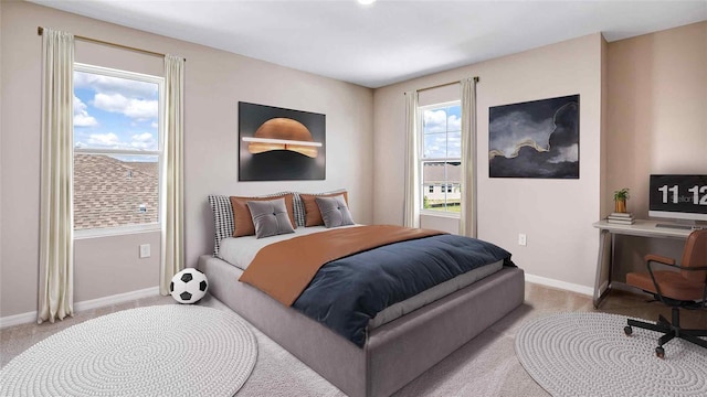 carpeted bedroom with multiple windows