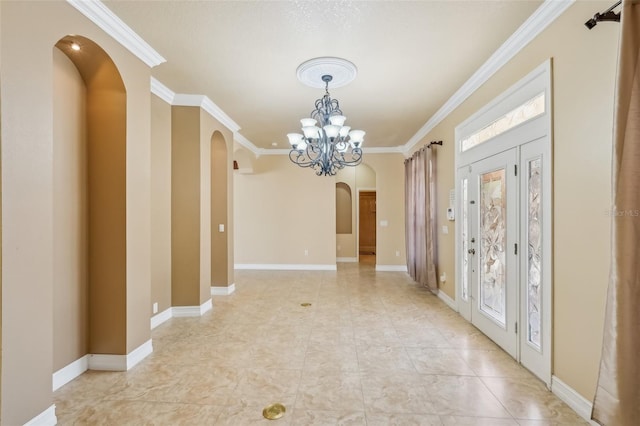 foyer featuring an inviting chandelier and ornamental molding