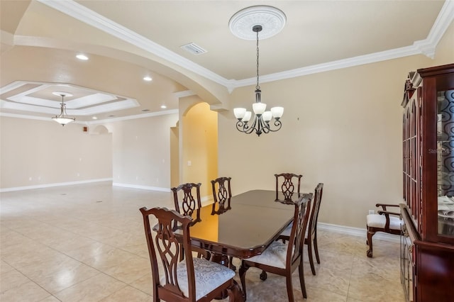 dining space with light tile patterned floors, a raised ceiling, ornamental molding, and a notable chandelier