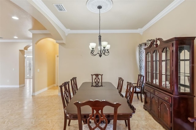 dining room featuring a notable chandelier, ornamental molding, and light tile patterned floors