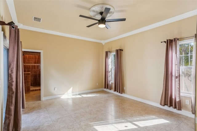 tiled empty room with ceiling fan and crown molding