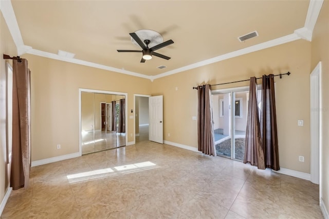 spare room featuring ceiling fan and ornamental molding