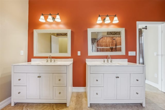 bathroom featuring tile patterned floors and vanity