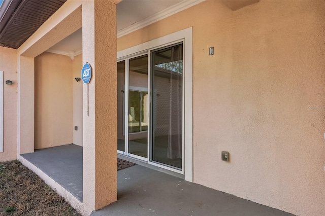 entrance to property with a patio area