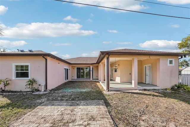 back of property featuring a patio