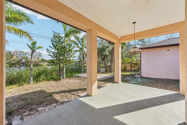 view of patio with a water view