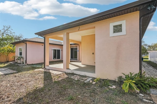 back of house with a patio