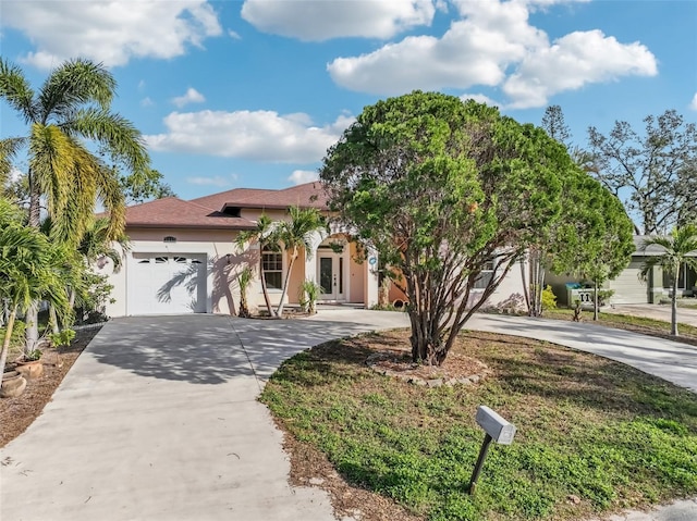 mediterranean / spanish home featuring a garage