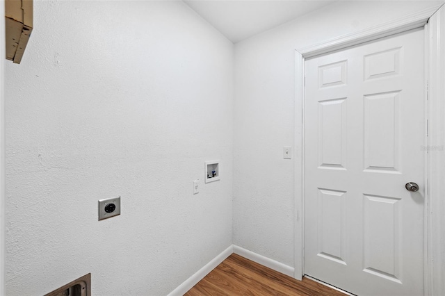 washroom with hardwood / wood-style floors, washer hookup, and hookup for an electric dryer