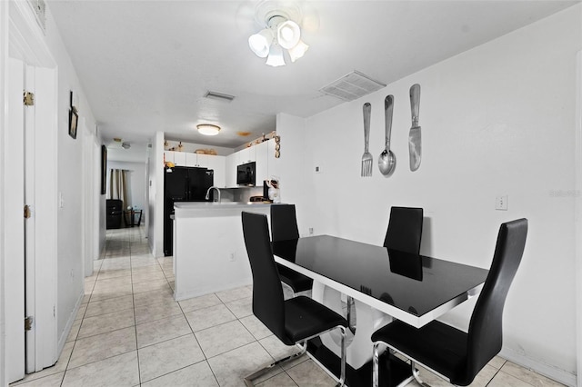 dining area with light tile patterned floors