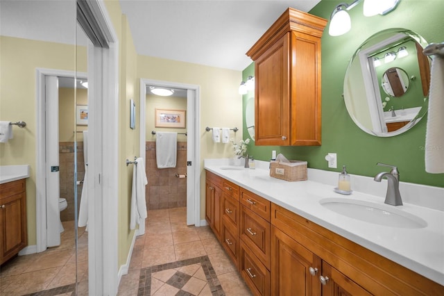 bathroom featuring tile patterned floors, vanity, and toilet