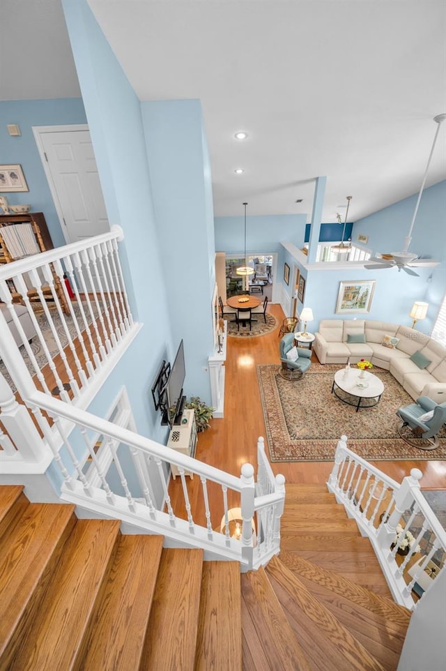 living room with ceiling fan and hardwood / wood-style floors